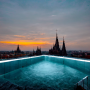 ironmike_an_infinity_pool_on_a_rooftop._there_is_an_open_elevat_39c1c39e-7fa9-40d8-af0b-dce5c27e94ae.png
